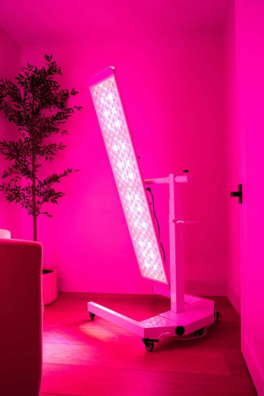 NEW The Panorama Panel in a stylish room, displaying adjustable height and colorful light therapy features.